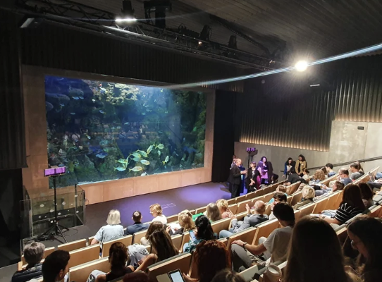 Science outreach talk at an aquarium auditorium